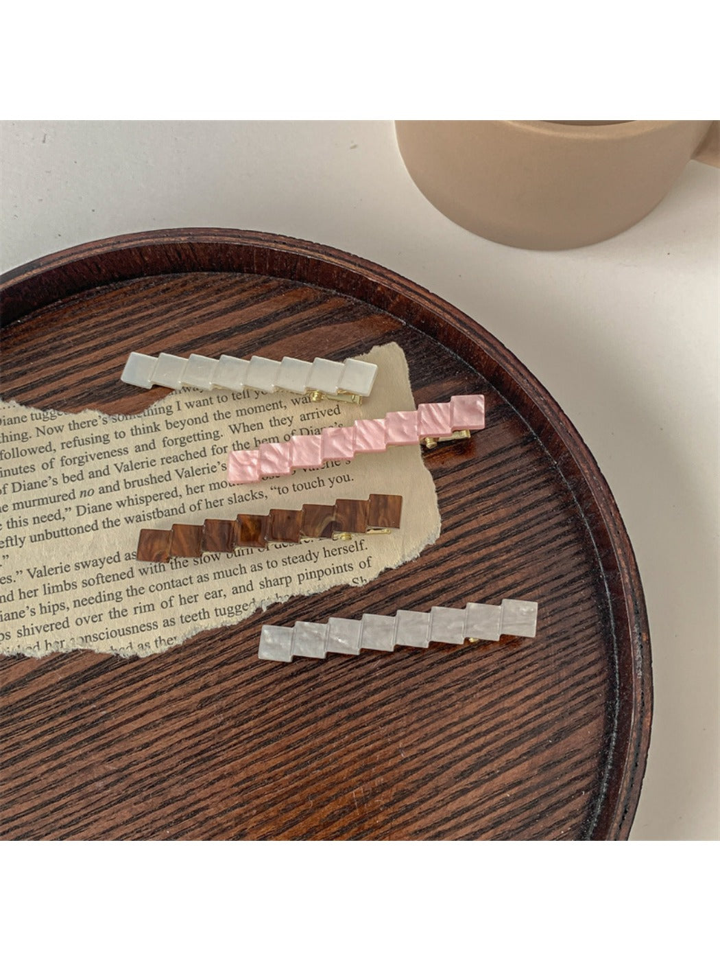 Close-up of Beau chic small square hair clip showing smooth surface and edges