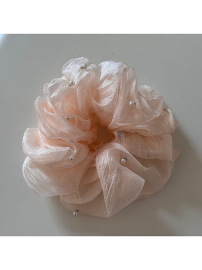 Gifty scrunchie stretched to show elasticity and fabric softness