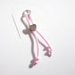 Side view of vibrant rope heart keychain highlighting rope thickness