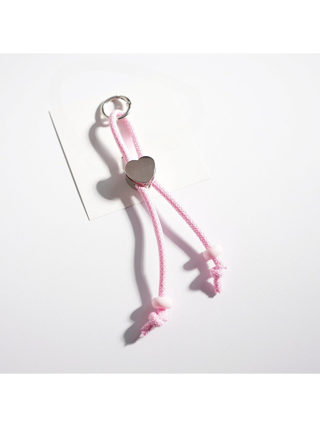 Side view of vibrant rope heart keychain highlighting rope thickness