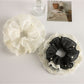 Gifty scrunchie styled on a wrist as a fashion accessory