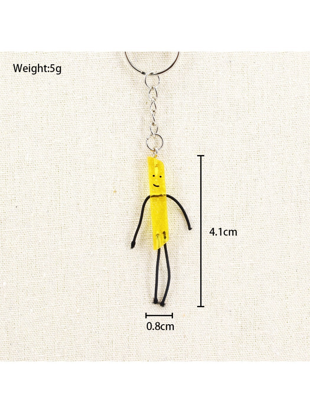 Mini French fries keychain hanging from a bag zipper pull