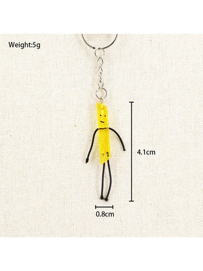 Mini French fries keychain hanging from a bag zipper pull