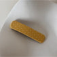 Beau hair clip angled to show both front polka dot design and back clasp