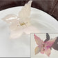 Beau hair claw clip in gradient colors held in hand