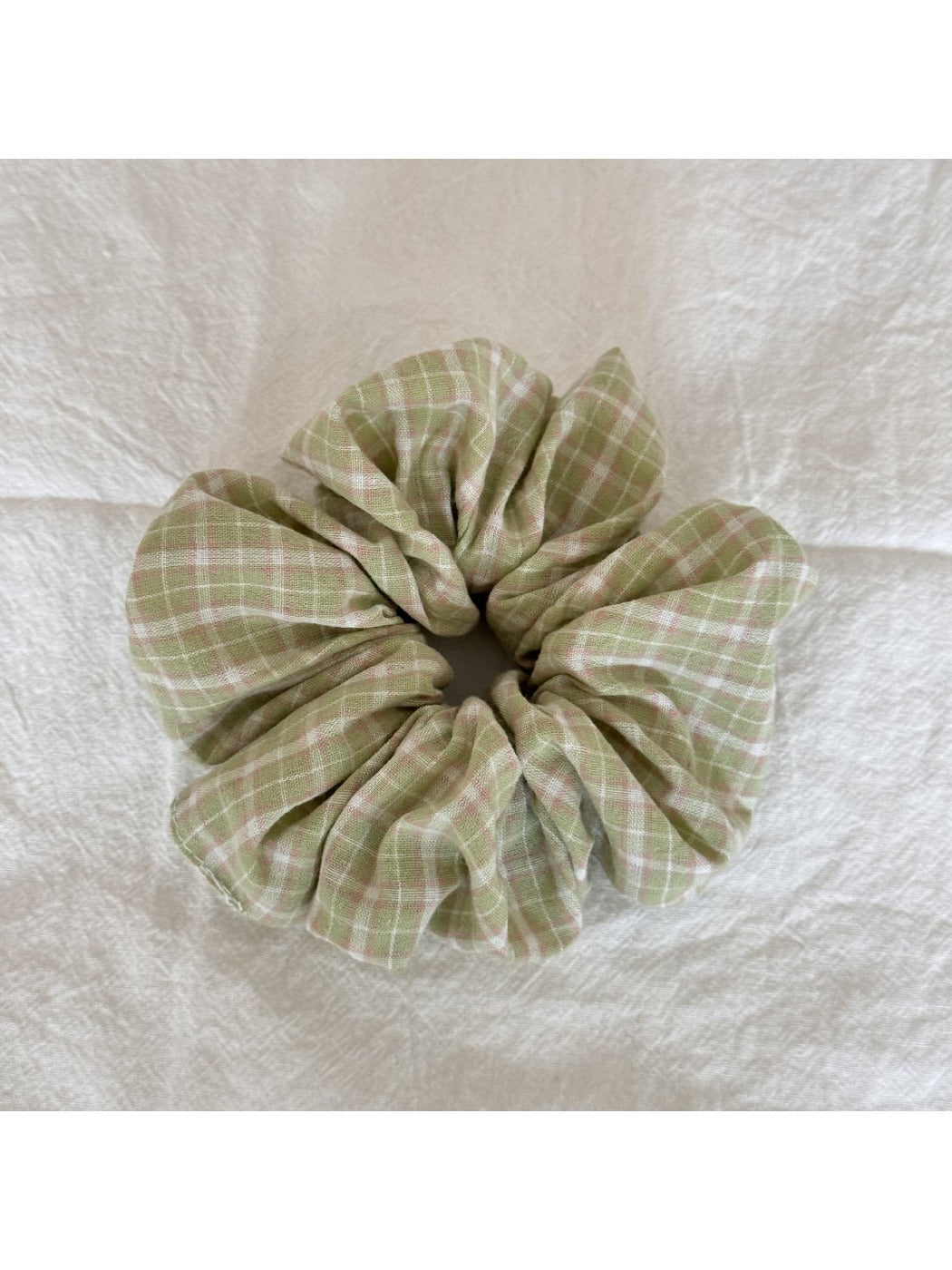 Gifty Sweet Green Style Scrunchie laid flat to show full circular shape and fabric pattern