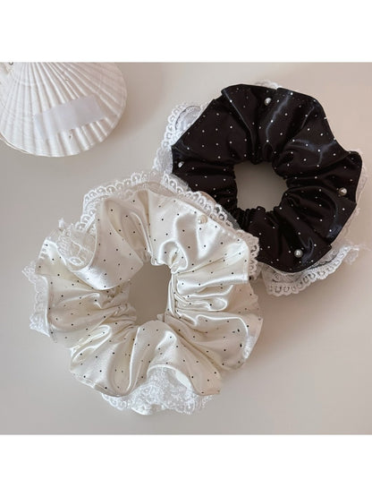 Gifty lively lightweight scrunchie with white polka dots on a pastel pink fabric