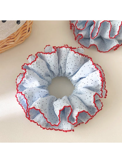 Top view of Gifty polka dot scrunchie highlighting ruffle details