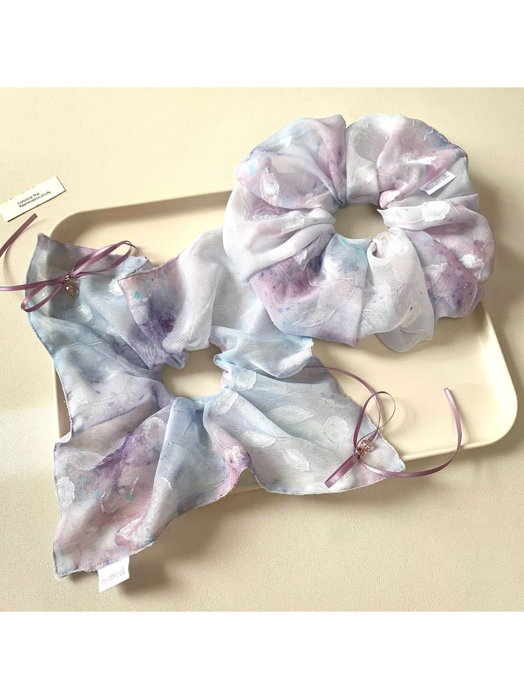 Close-up of Gifty stylish minimalist ombre scrunchie in soft pastel colors