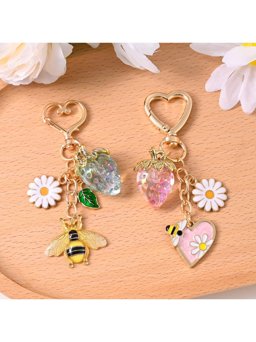 Close-up of a gold alloy bee-shaped keychain with detailed wings and body