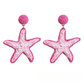 Top view of the woven raffia texture on the starfish stud earrings
