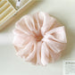 Gifty Pure Simple Mesh Scrunchie stretched to show elasticity