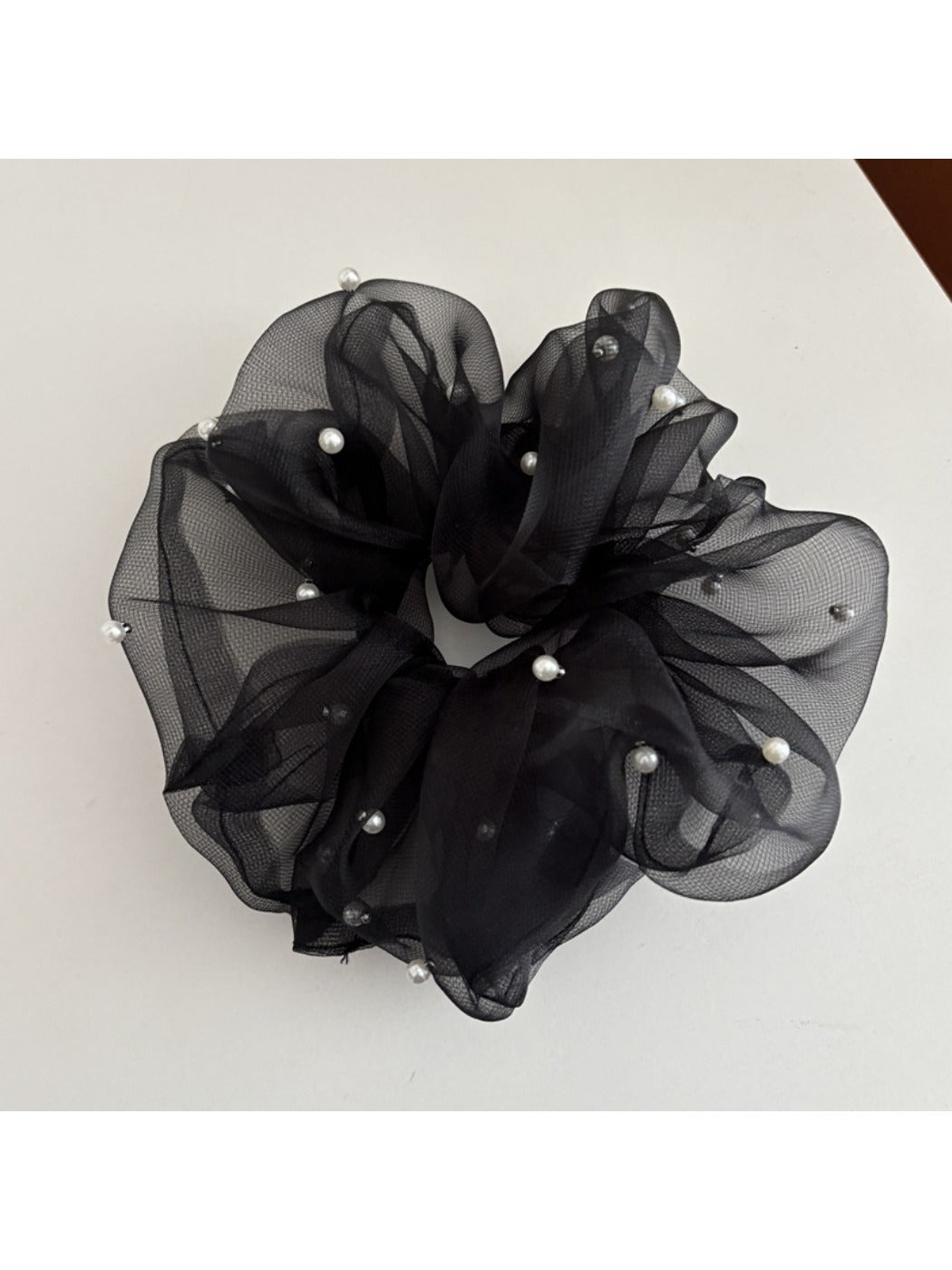 Model wearing Gifty elegant chic tulle scrunchie in a loose ponytail