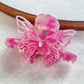 Beau butterfly hair claw clip shown with packaging box
