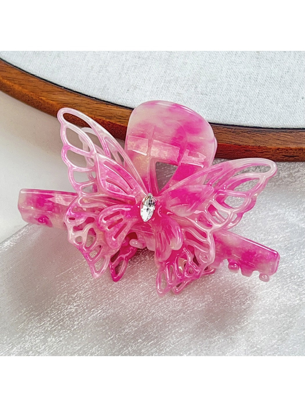 Beau butterfly hair claw clip shown with packaging box