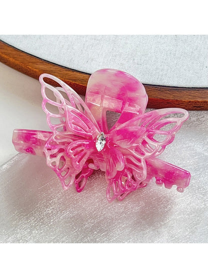 Beau butterfly hair claw clip shown with packaging box