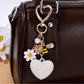 Rhinestone heart keychain displayed on a flat surface highlighting shine and texture