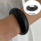 Lovra polished round bracelet photographed with soft lighting for detail