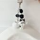Set of cat and fish keychains attached to a backpack zipper pull