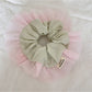 Side view of Gifty color block ruffle scrunchie with pink and beige tulle layers
