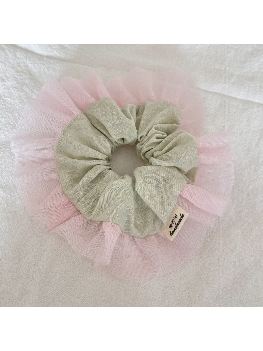 Side view of Gifty color block ruffle scrunchie with pink and beige tulle layers