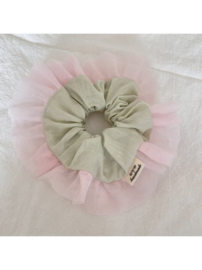 Side view of Gifty color block ruffle scrunchie with pink and beige tulle layers
