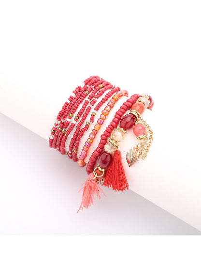 Lovra beaded bracelet worn on wrist highlighting colorful beads and tassel charm