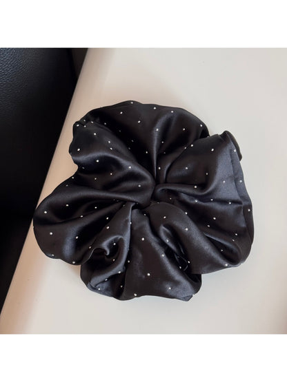Gifty rhinestone decor satin scrunchie displayed with matching accessories