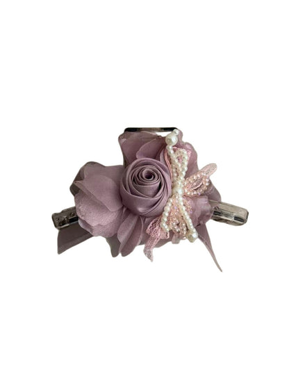 Side view of Beau flower shaped claw clip highlighting clip mechanism