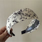 Folded Gifty headband displaying wide edges and floral print