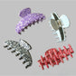 Top view of Beau Irregular Polka Dot Claw Clip with irregular white dots