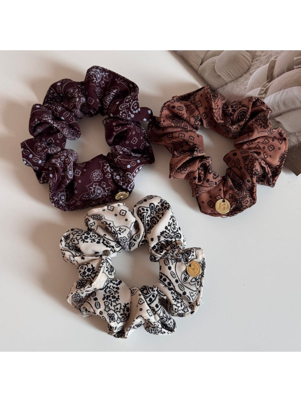 Side view of Gifty printed scrunchie highlighting fabric texture and elastic band