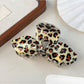 Top view of Beau leopard print bow-shaped claw clip