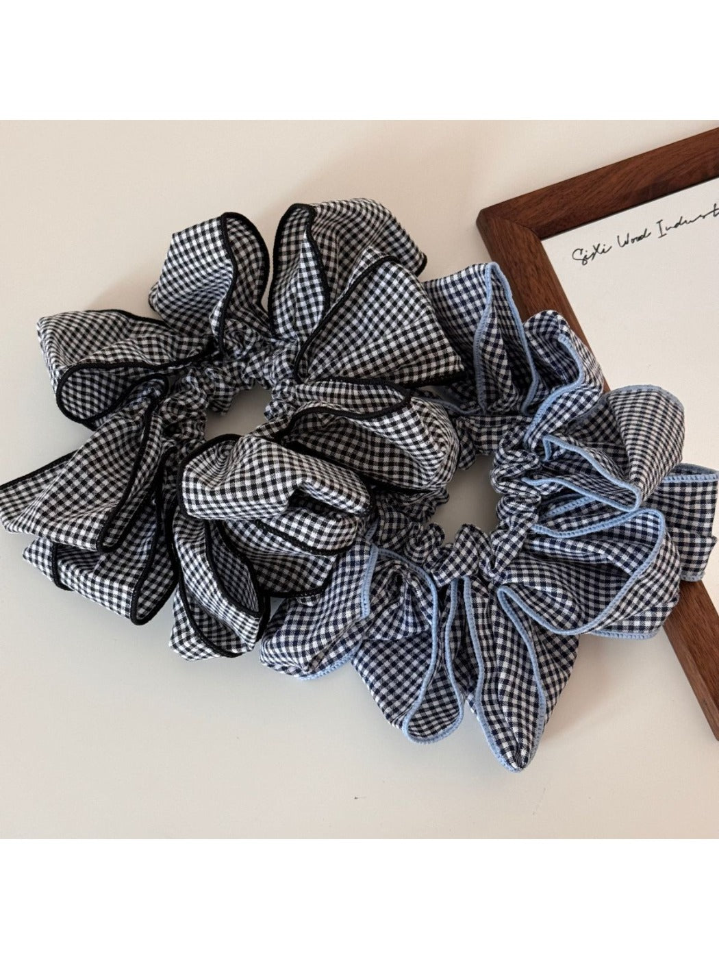 Gifty classic checked pattern scrunchie in black and white fabric close-up