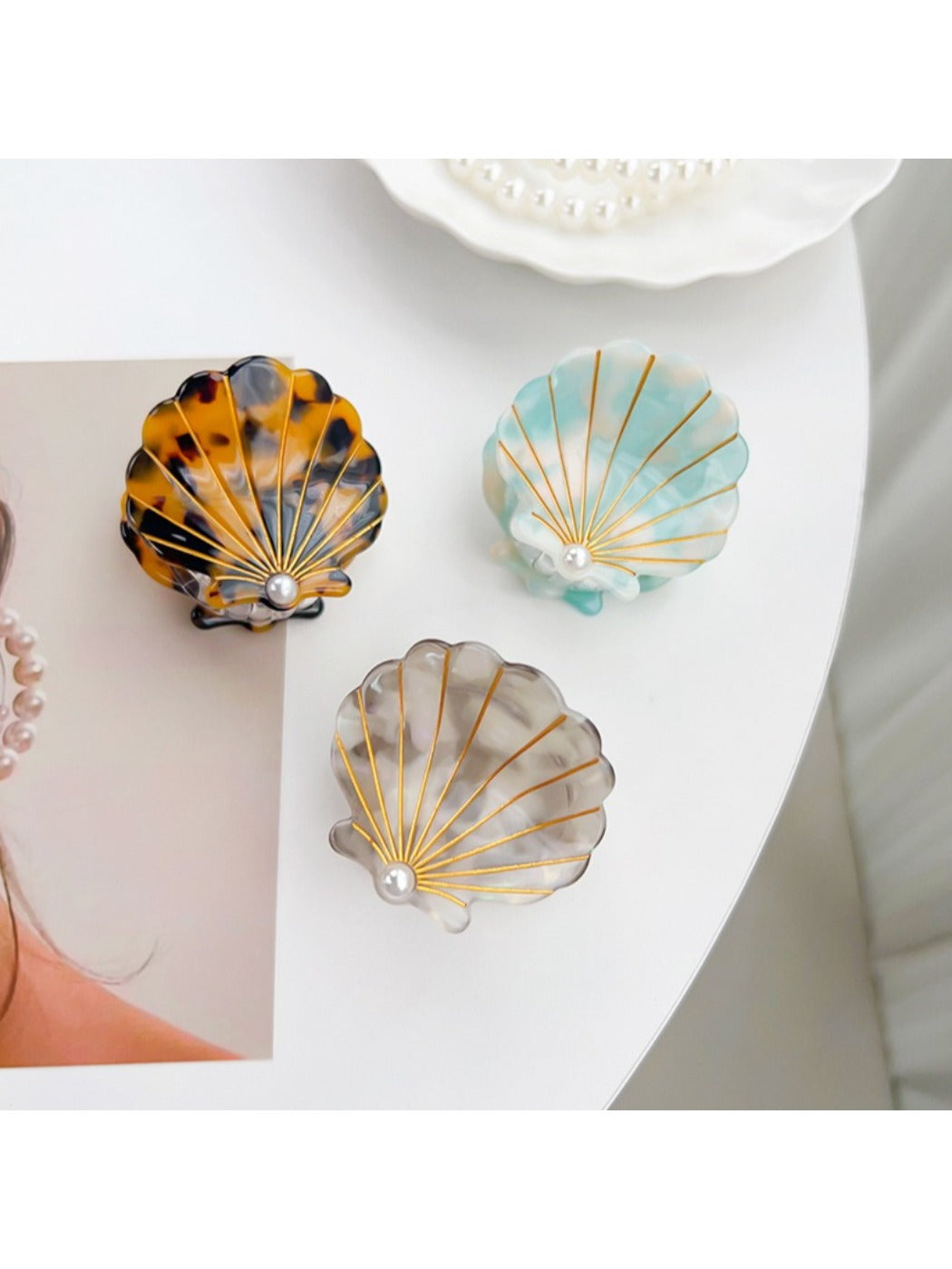 Close-up of Beau shell shaped hair claw clip showing curved teeth