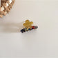 Top view of Beau fresh acetate flower shaped hair clip showing petal details