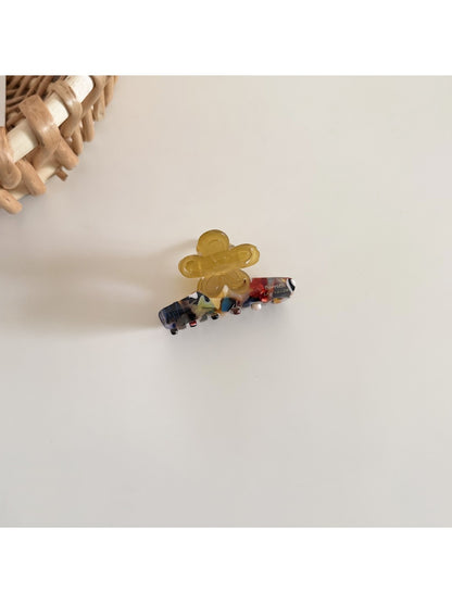 Top view of Beau fresh acetate flower shaped hair clip showing petal details