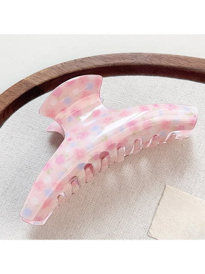 Beau Sweet Pink Floral Print Hair Claw Clip displayed on a wooden surface