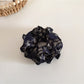 Model wearing Gifty vintage floral ruffled scrunchie in loose hair bun