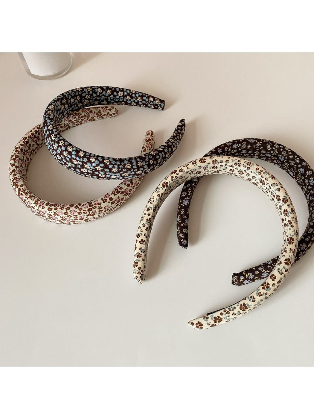 Side view of Gifty wide headband highlighting fabric texture and floral design