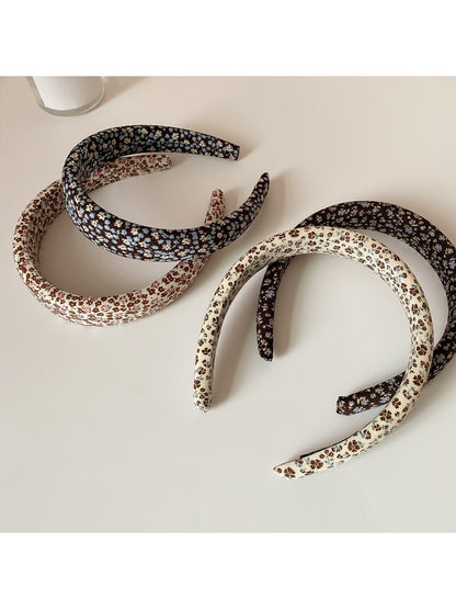 Side view of Gifty wide headband highlighting fabric texture and floral design