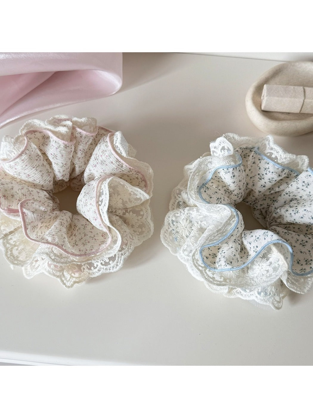 Close-up of Gifty lace trim tiny floral scrunchie with pink and white flowers