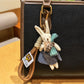 Rabbit charm keychain attached to a backpack zipper pull