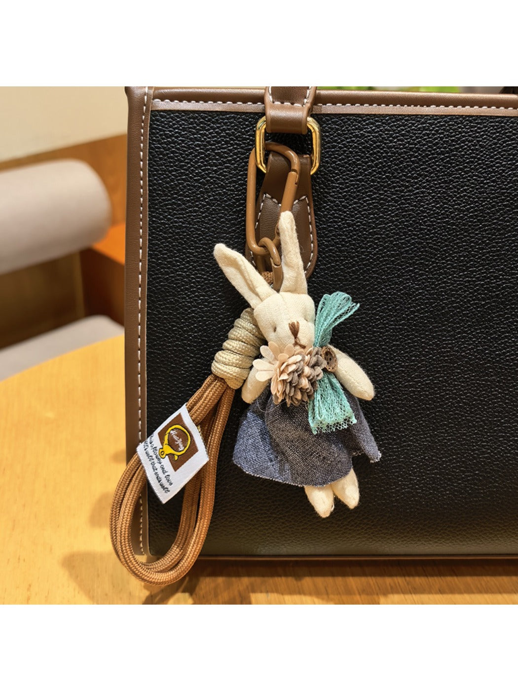 Rabbit charm keychain attached to a backpack zipper pull
