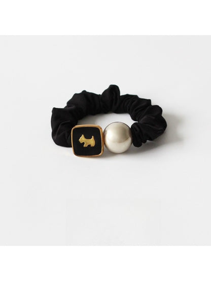 Gifty modern round bead hair tie displayed with matching accessories