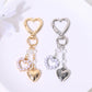 Alloy heart shaped keychain with smooth metallic finish on white background