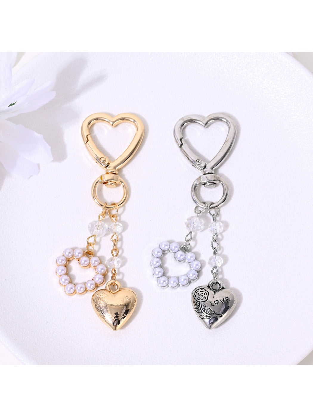 Alloy heart shaped keychain with smooth metallic finish on white background