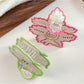 Beau vintage leaf shaped hair claw clip held in hand to show size and scale