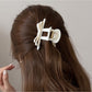 Side view of Beau T shaped bow hair claw clip highlighting bow design