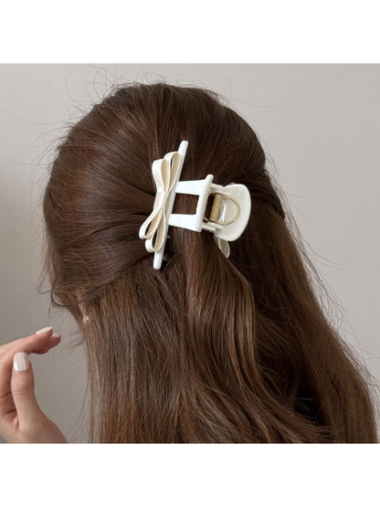 Side view of Beau T shaped bow hair claw clip highlighting bow design